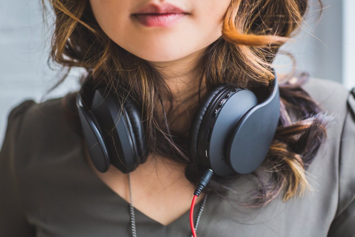 woman wearing headset on neck