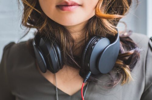 woman wearing headset on neck